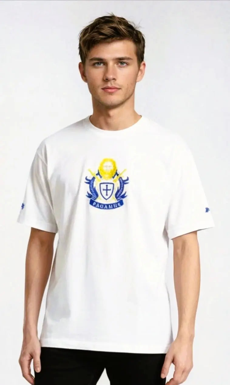 Person wearing a white Paganus t-shirt with a volumus nos patrium redire logo on a white background