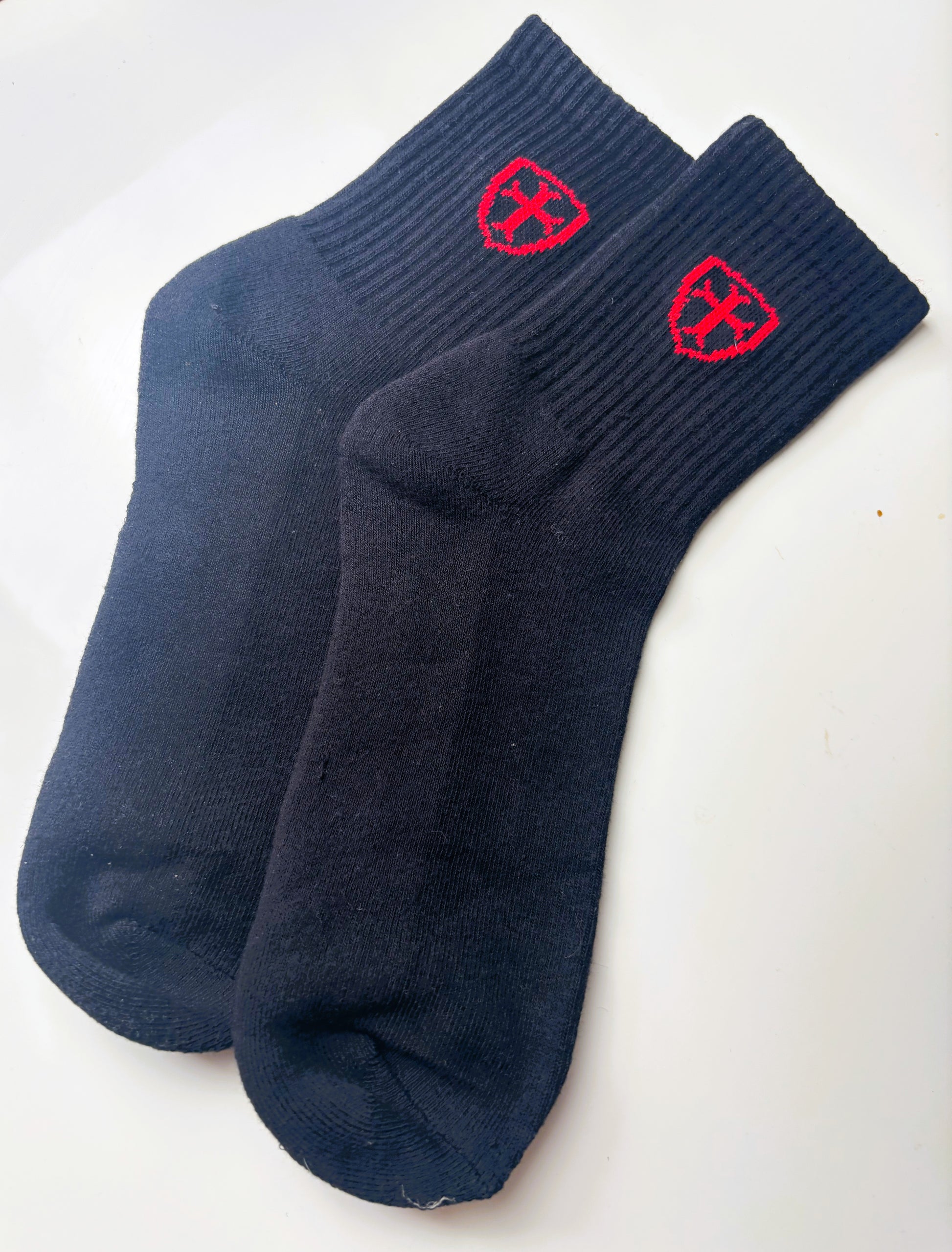Pair of black socks with red logo