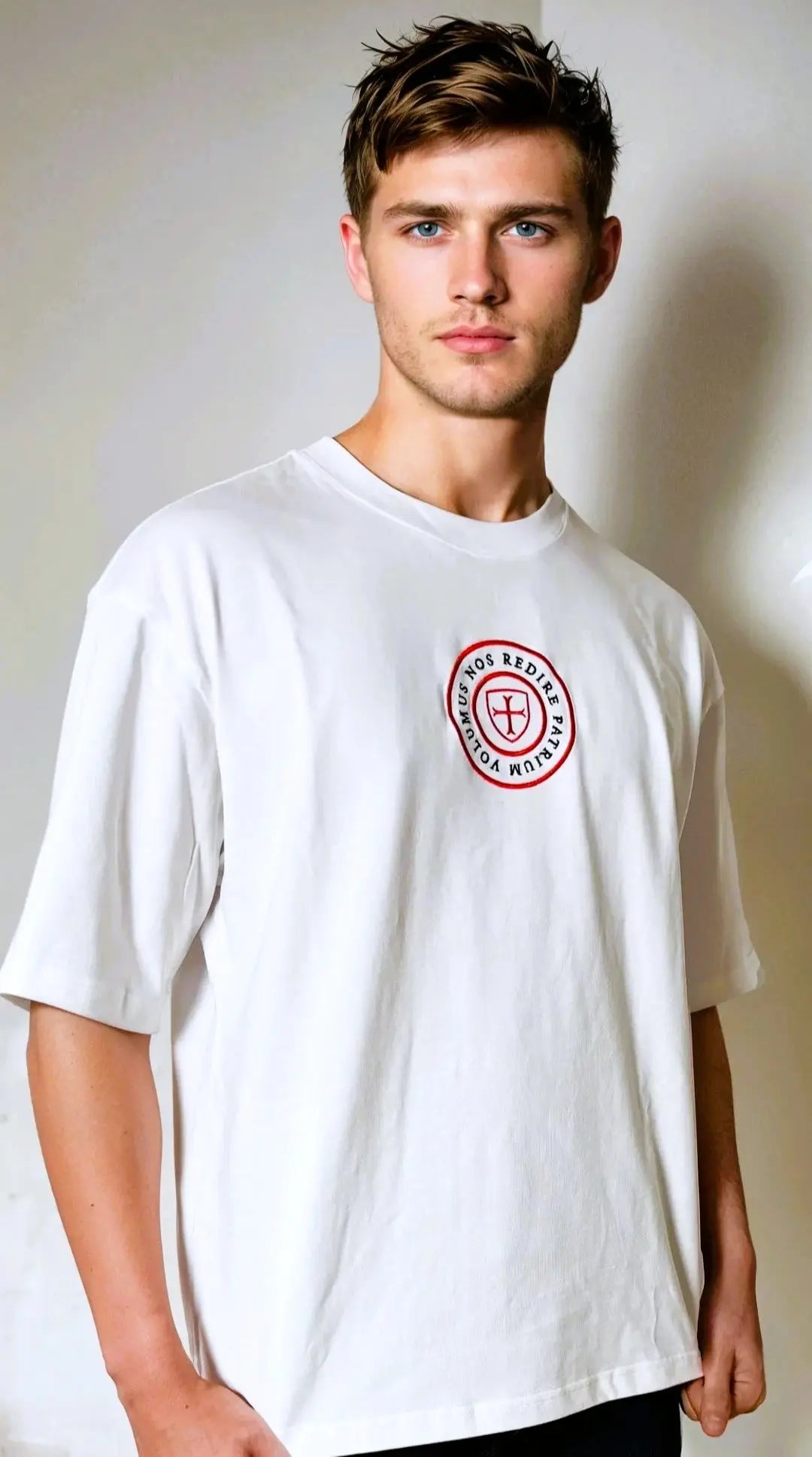 Paganus 280 gsm white t-shirt with a red logo. volumus nos patrium redire