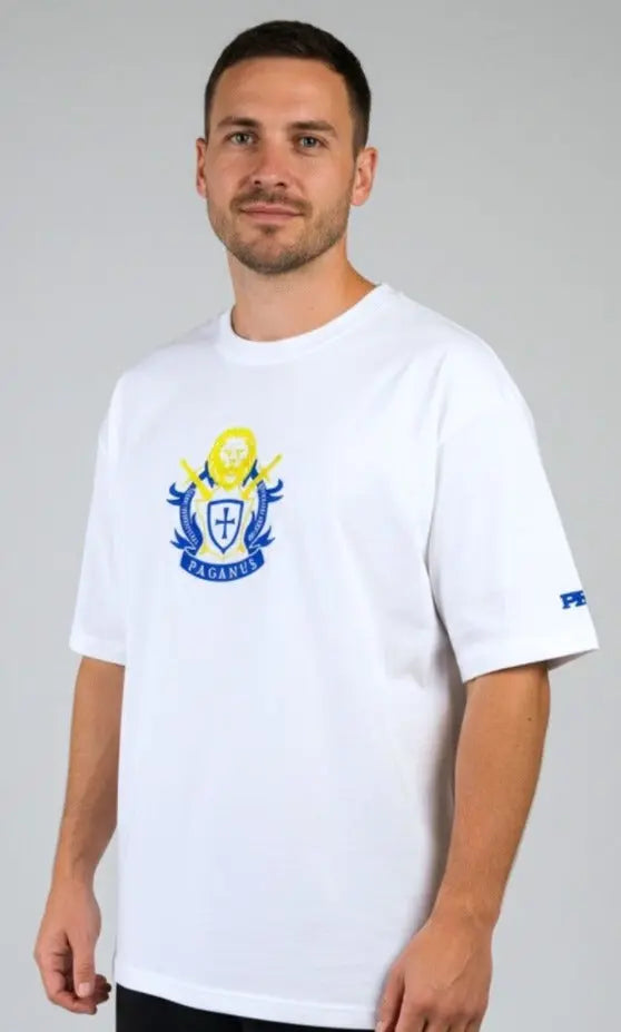 Person wearing a white Paganus t-shirt with a volumus nos patrium redire logo on a white background