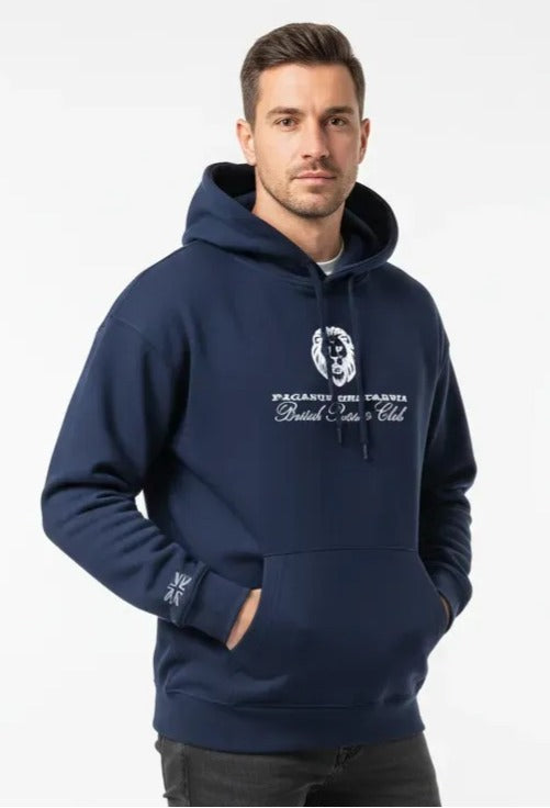 Man wearing a navy blue hoodie with a logo and text on a white background