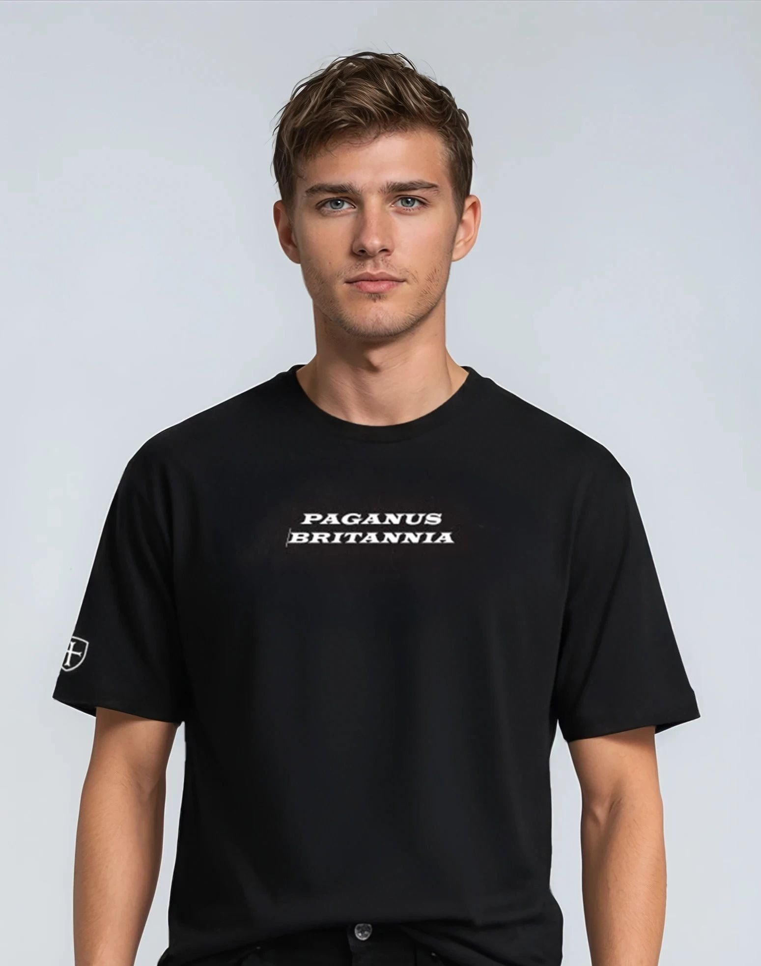 Man wearing a black 300 gsm t-shirt with 'PAGANUS BRITANNIA'