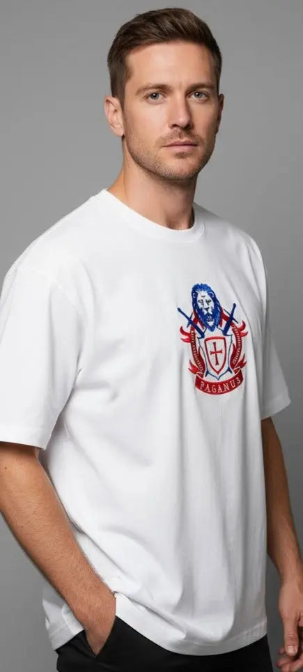 Man wearing a white paganus  t-shirt with a patriot logo 