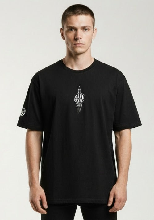 Man wearing a Paganus Britannia black t-shirt with a fuck you middle finger design in white silk  embroidery