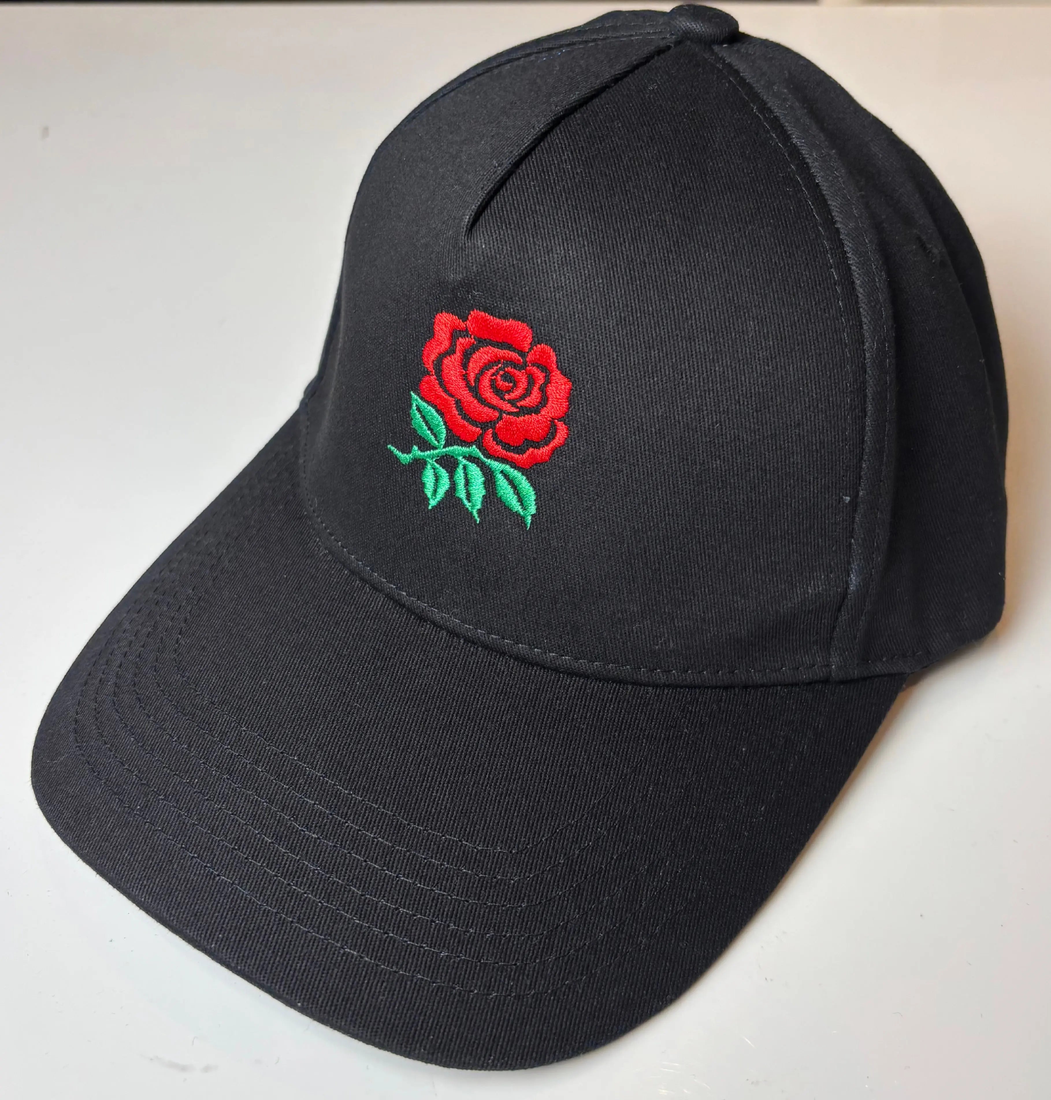 Black Paganus cap with a red English rose 