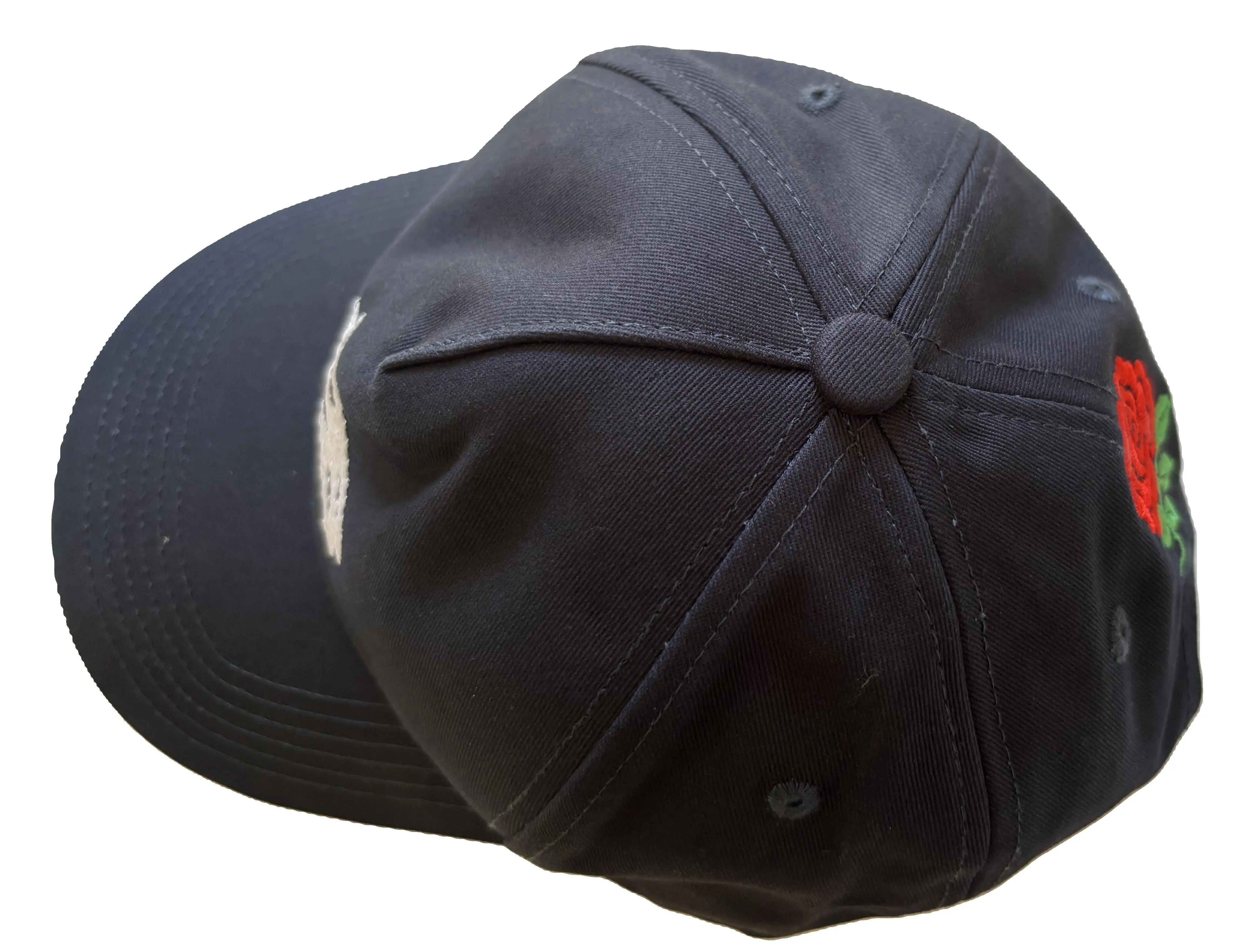 Navy blue baseball cap with a red English rose embroidery
