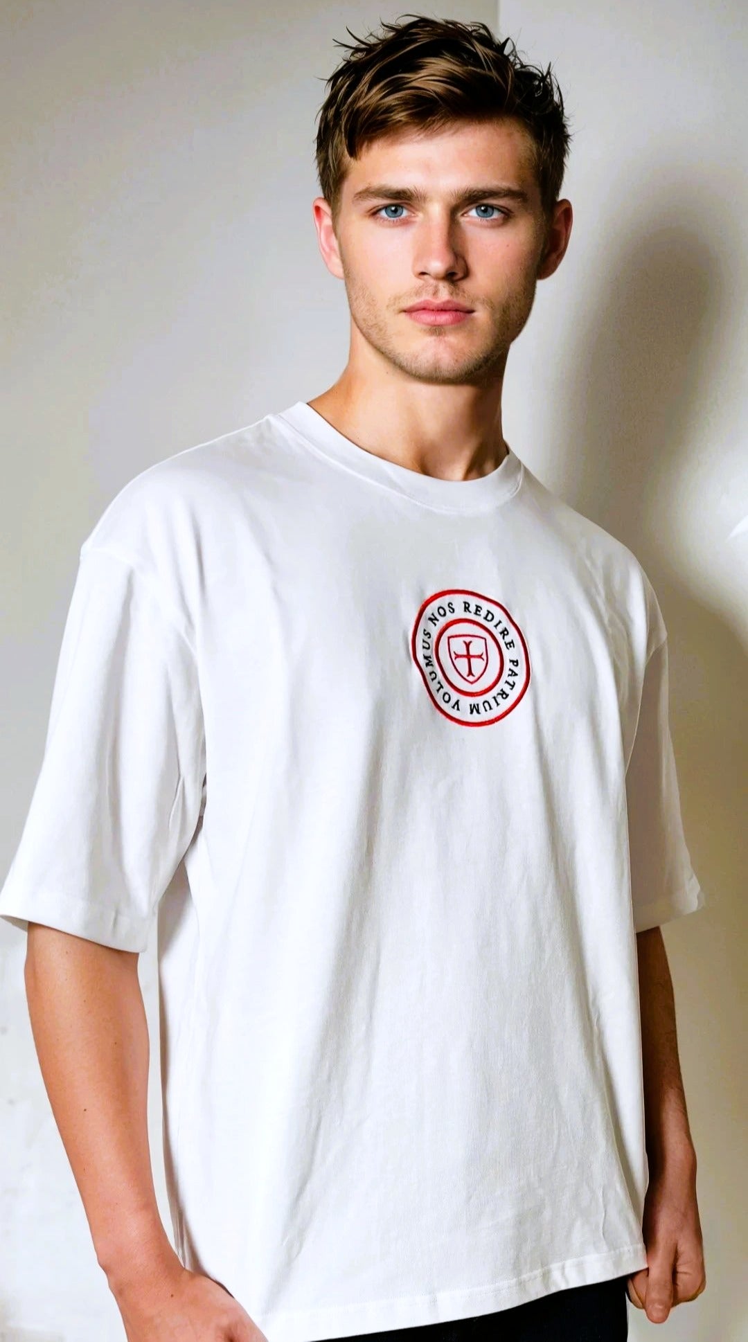 Paganus 280 gsm white t-shirt with a red logo. volumus nos patrium redire