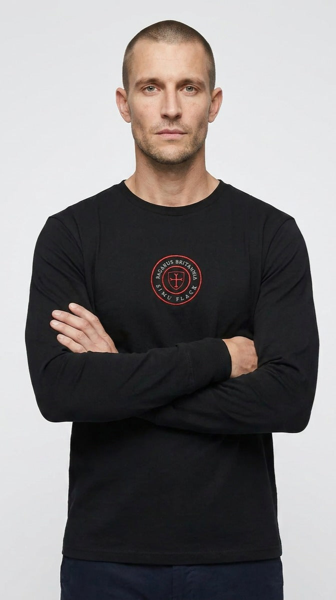 Man wearing a black long-sleeve shirt with a red logo on a white background