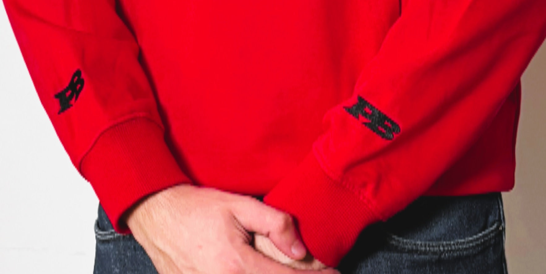 Red hoodie with a white logo 