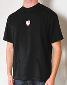 Paganus 260gsm  black t-shirt with a red and white patriot shield logo
