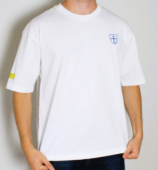 White t-shirt with a small logo on a plain background
