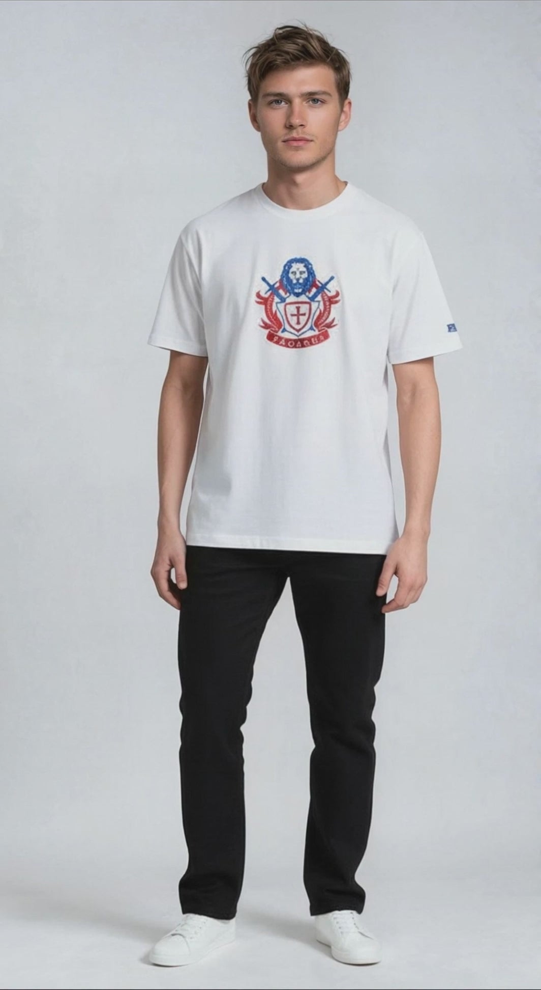 Man wearing a white paganus  t-shirt with a patriot logo 