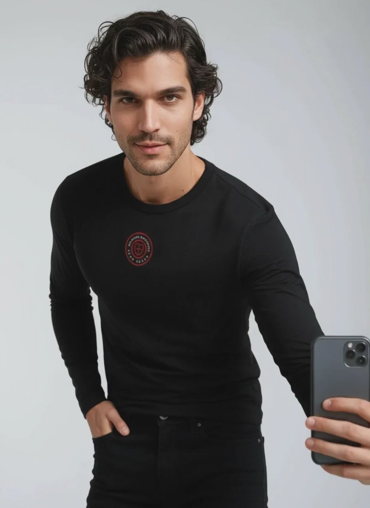 Man wearing a black Paganus Britannia long-sleeve t-shirt 