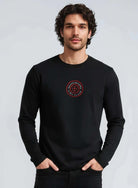 Man wearing a black Paganus Britannia long-sleeve t-shirt 