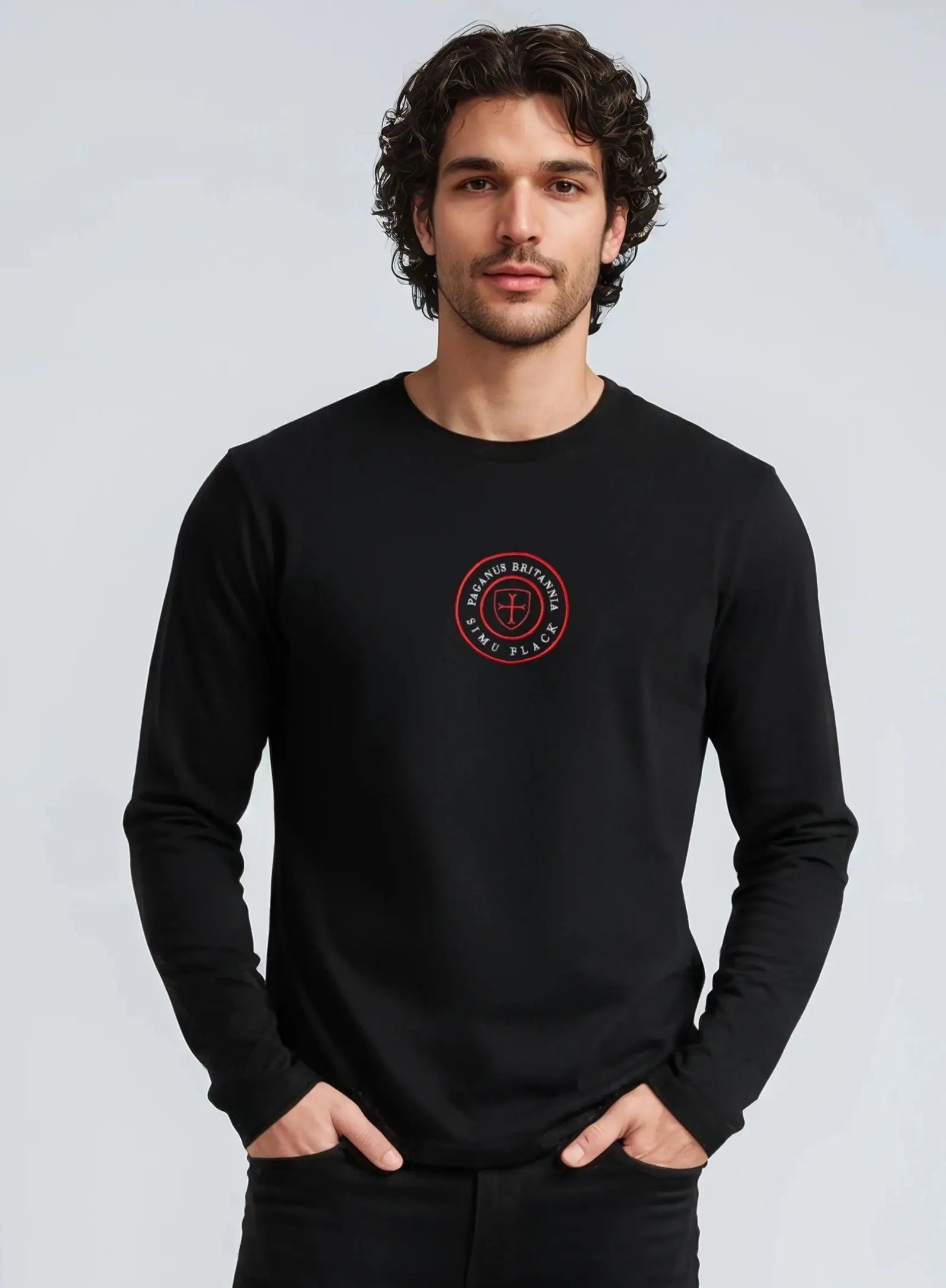 Man wearing a black Paganus Britannia long-sleeve t-shirt 