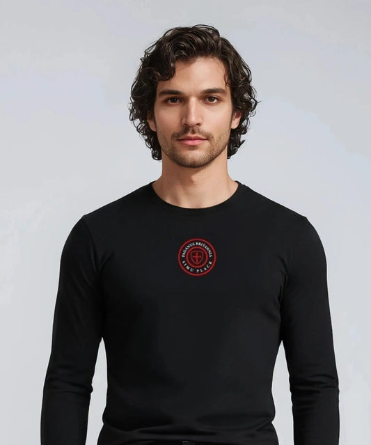 Man wearing a black Paganus Britannia long-sleeve t-shirt 
